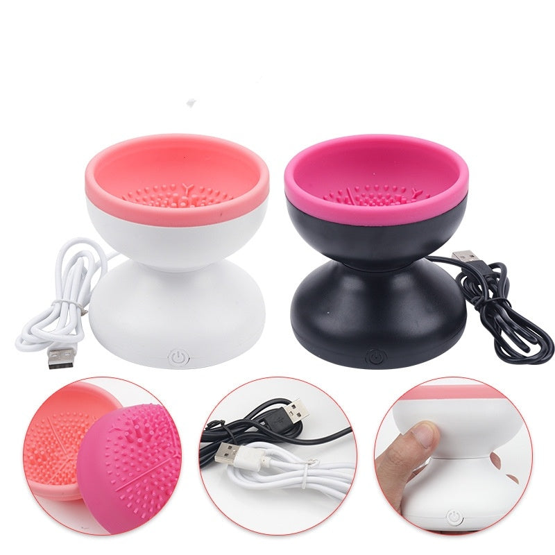 Electric makeup brush cleaner in pink and black with USB charging for easy brush maintenance