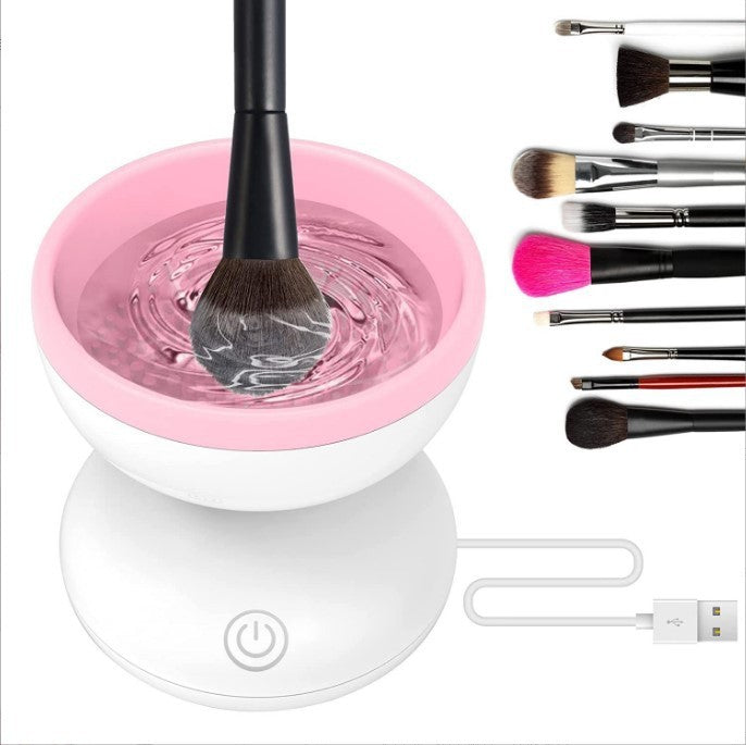 Electric makeup brush cleaner with pink bowl and various brushes for efficient cleaning