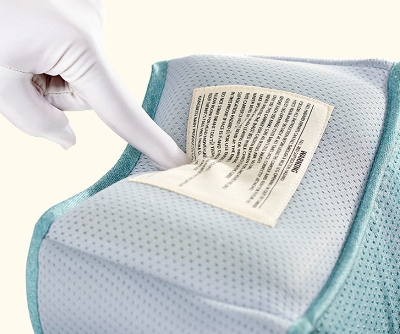 Close-up of the soft fabric on the Mystore ergonomic baby carrier with care instructions