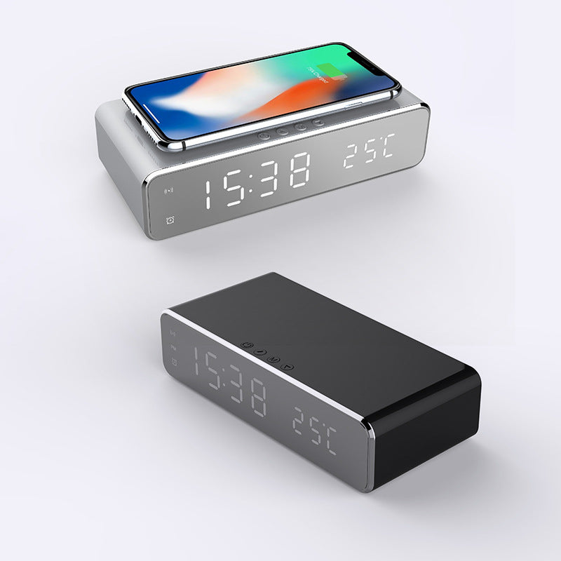 Modern LED alarm clock with wireless charger displaying time and temperature for convenient bedside use