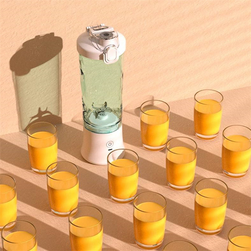 Mystore portable blender juicer with clear container and white base surrounded by glasses of juice