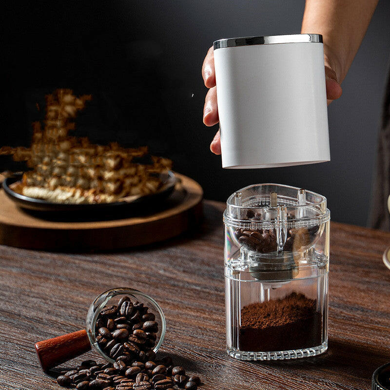 Mystore portable electric coffee grinder with a sleek design and a transparent chamber for grinding beans