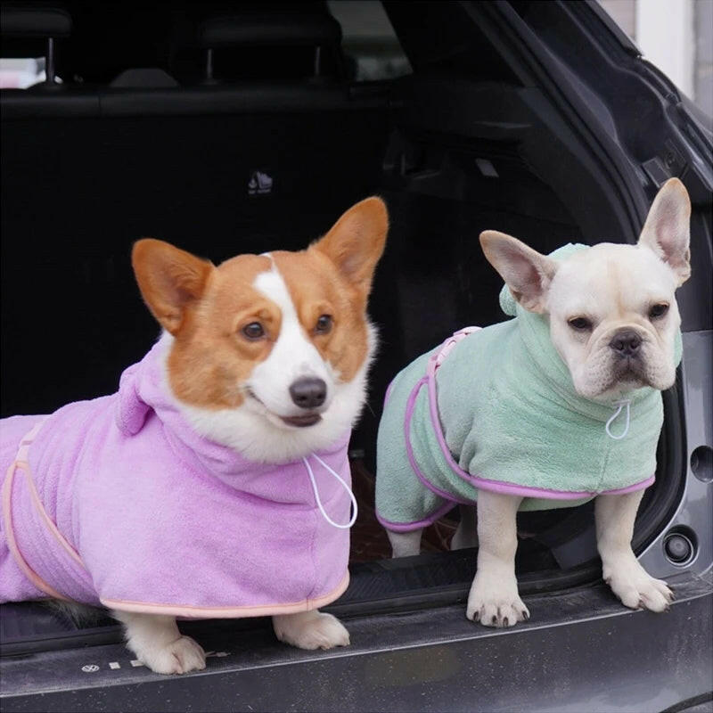 Two dogs in cozy capes made from super absorbent dog bath towel for quick drying after baths