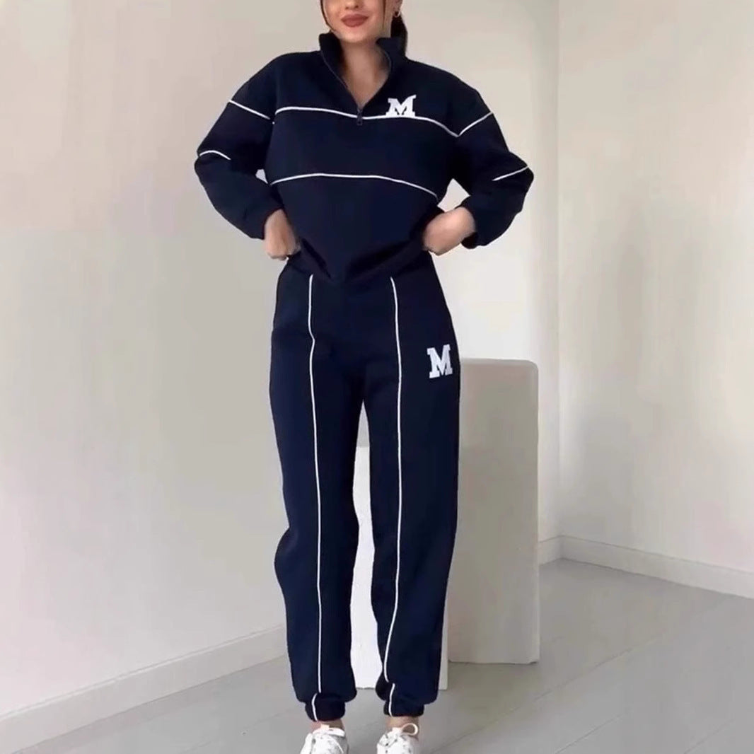 Navy women's lounge sweatsuit set with white piping and logo on top and pants