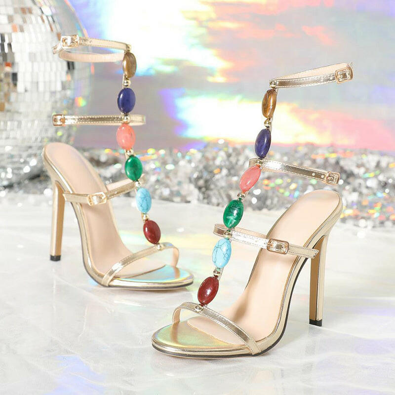Elegant women's high heel party shoes in gold with colorful gemstone accents and stylish strap design