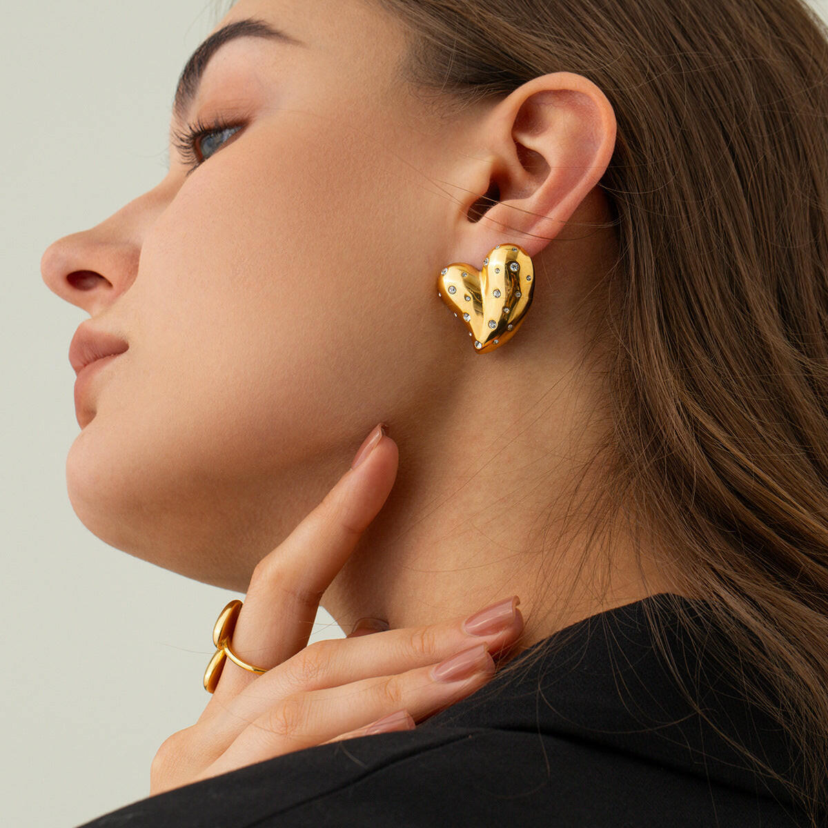 Trendy 18K gold heart earrings with unique design, perfect for everyday wear or special occasions