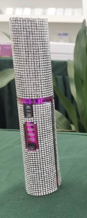 Glittering 2-in-1 hair curler and straightener with a stylish rhinestone design for versatile styling