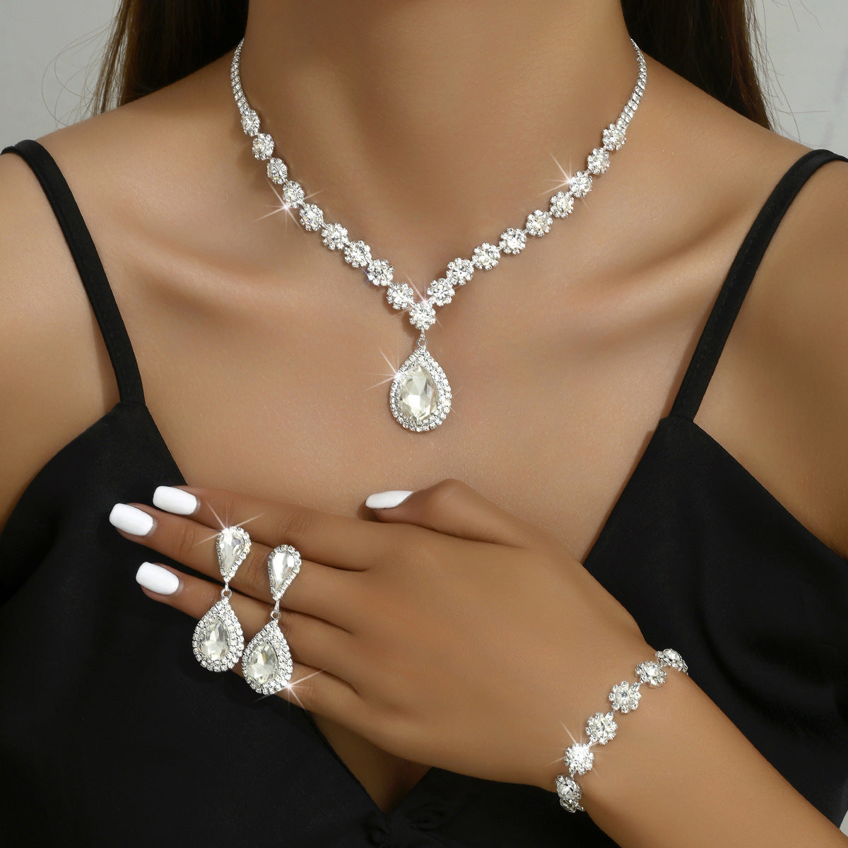 Elegant Mystore bridal jewelry set featuring a necklace, earrings, and bracelet with sparkling crystals