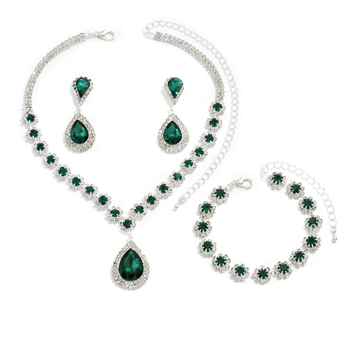 Elegant bridal jewelry set featuring emerald green stones in a sparkling silver design