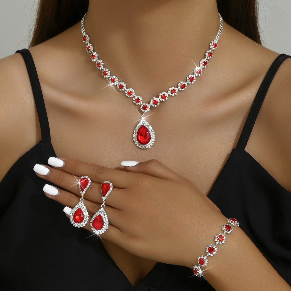 Elegant bridal jewelry set featuring red and silver accents, perfect for weddings and special occasions