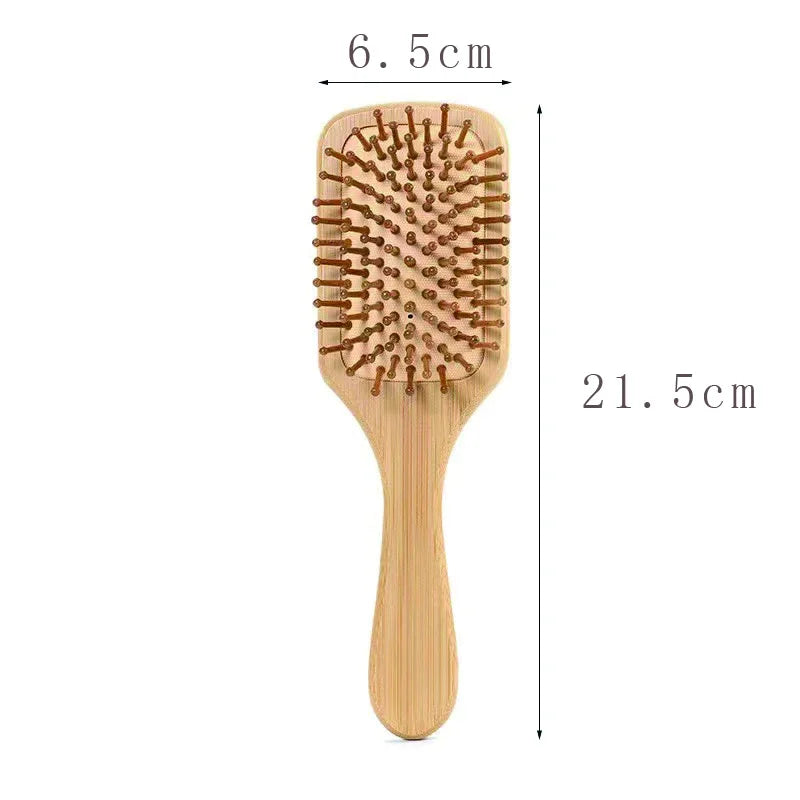 Custom engraved wooden hair brush with a smooth bamboo handle and rounded bristle design for gentle detangling