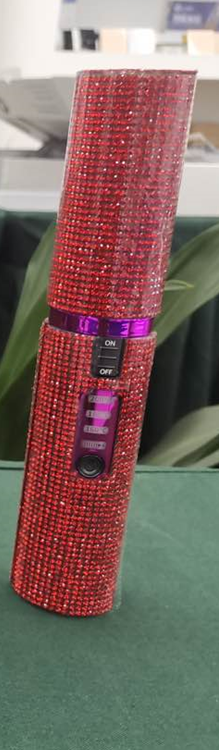 Sparkly red 2-in-1 hair curler and straightener with control buttons for versatile styling