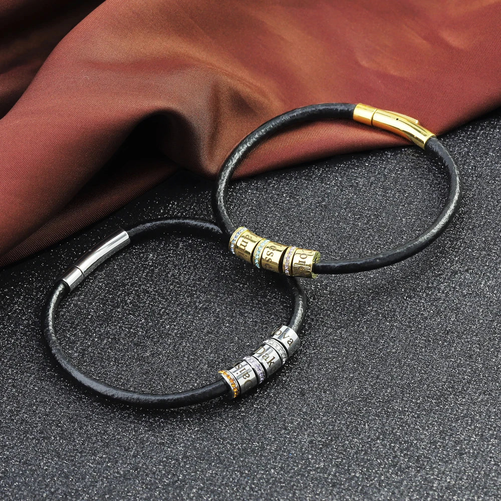 Two personalized name bracelets with leather bands and metal accents for stylish customization